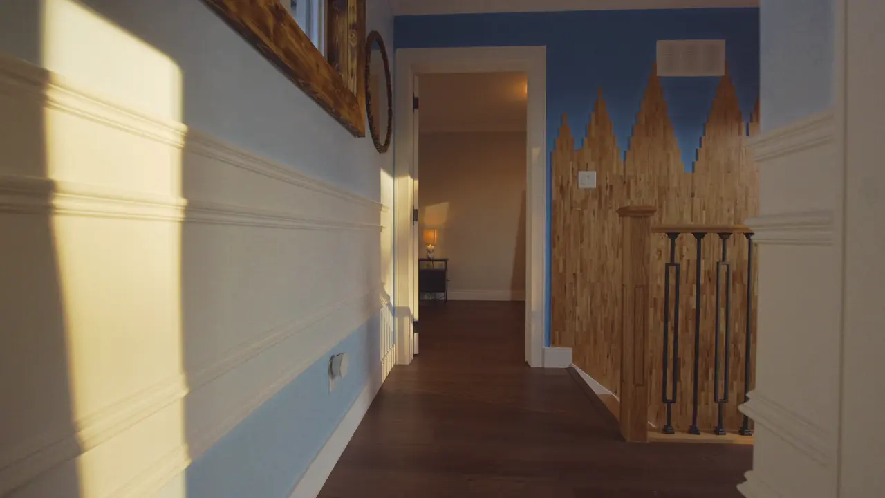 The landing and stair, painted with a mountain mural